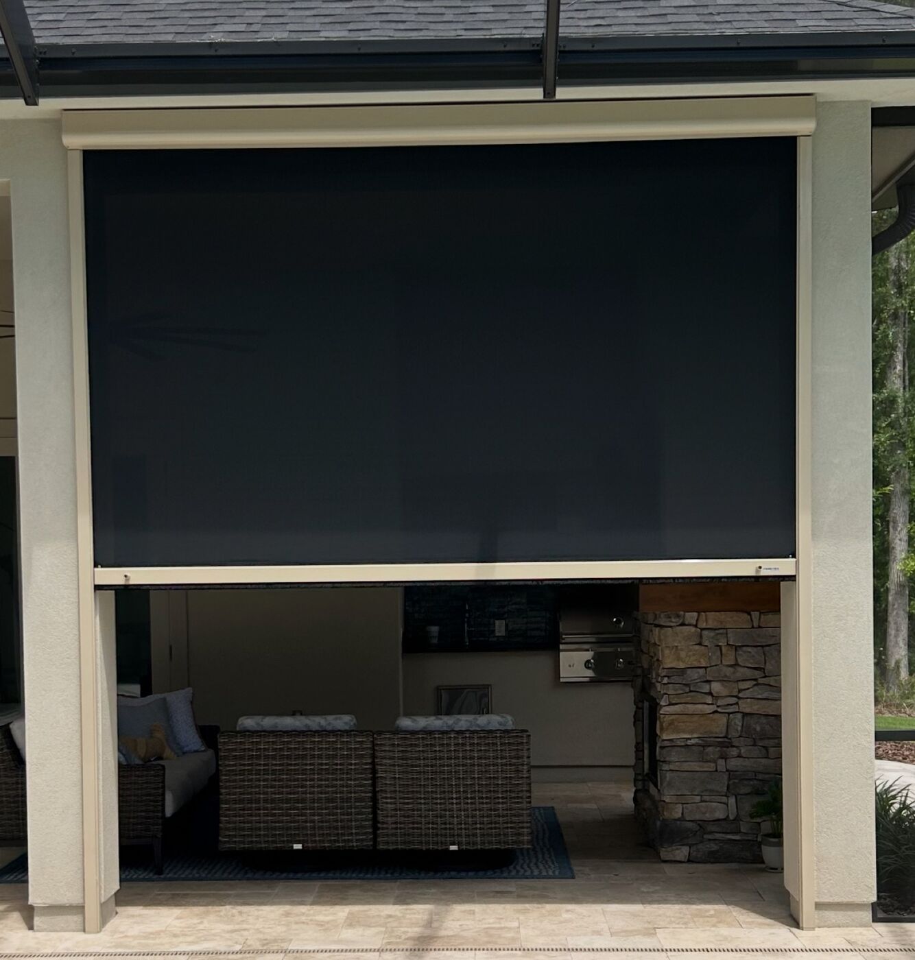 Outdoor kitchen under a screened lanai