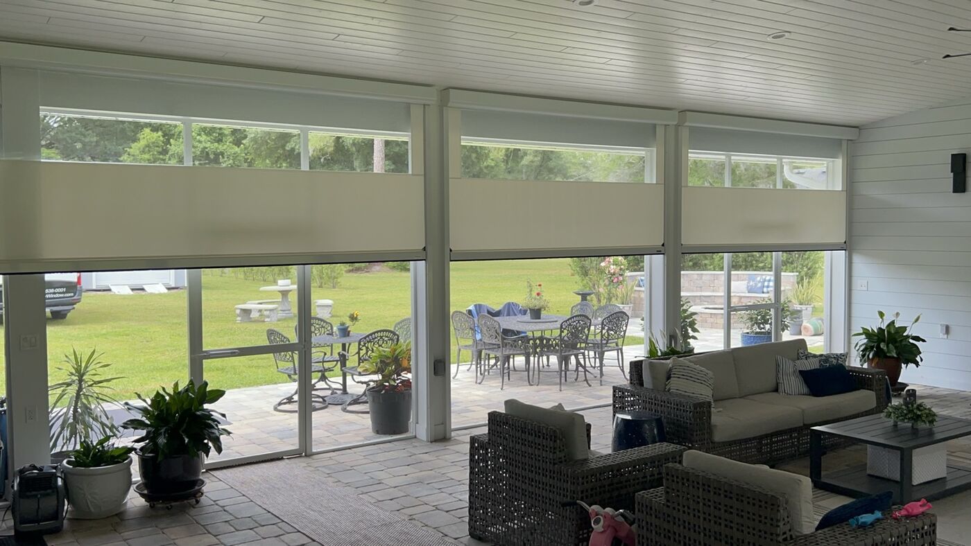 Motorized vinyl screen enclosure on a screened room