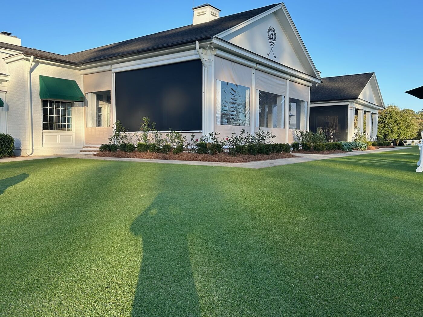 Motorized vinyl screens on a home front elevation