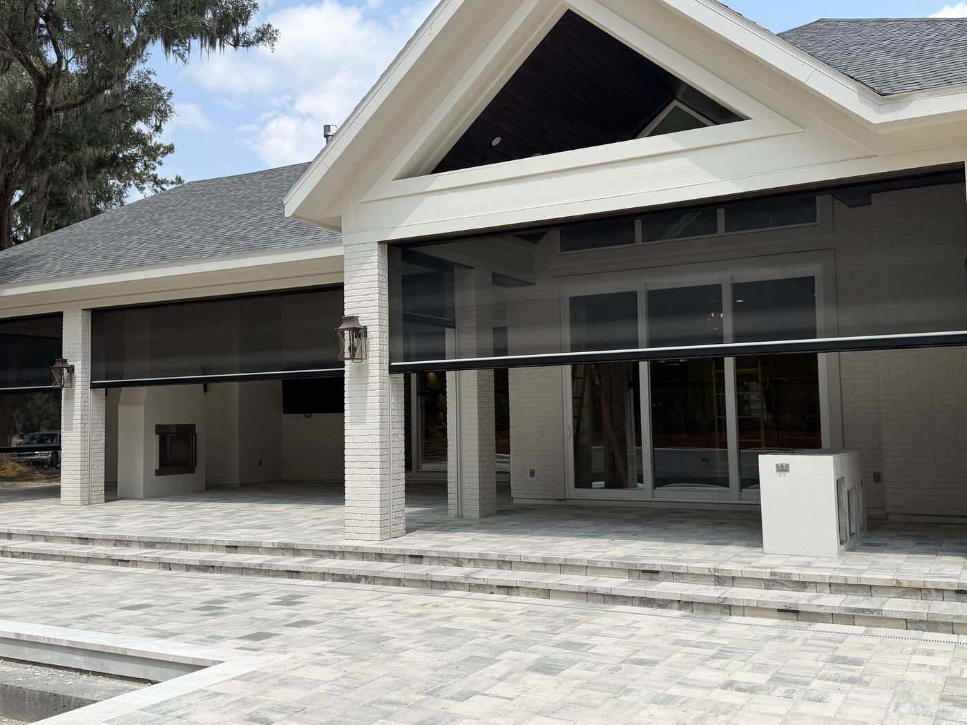 Rear porch with motorized screens