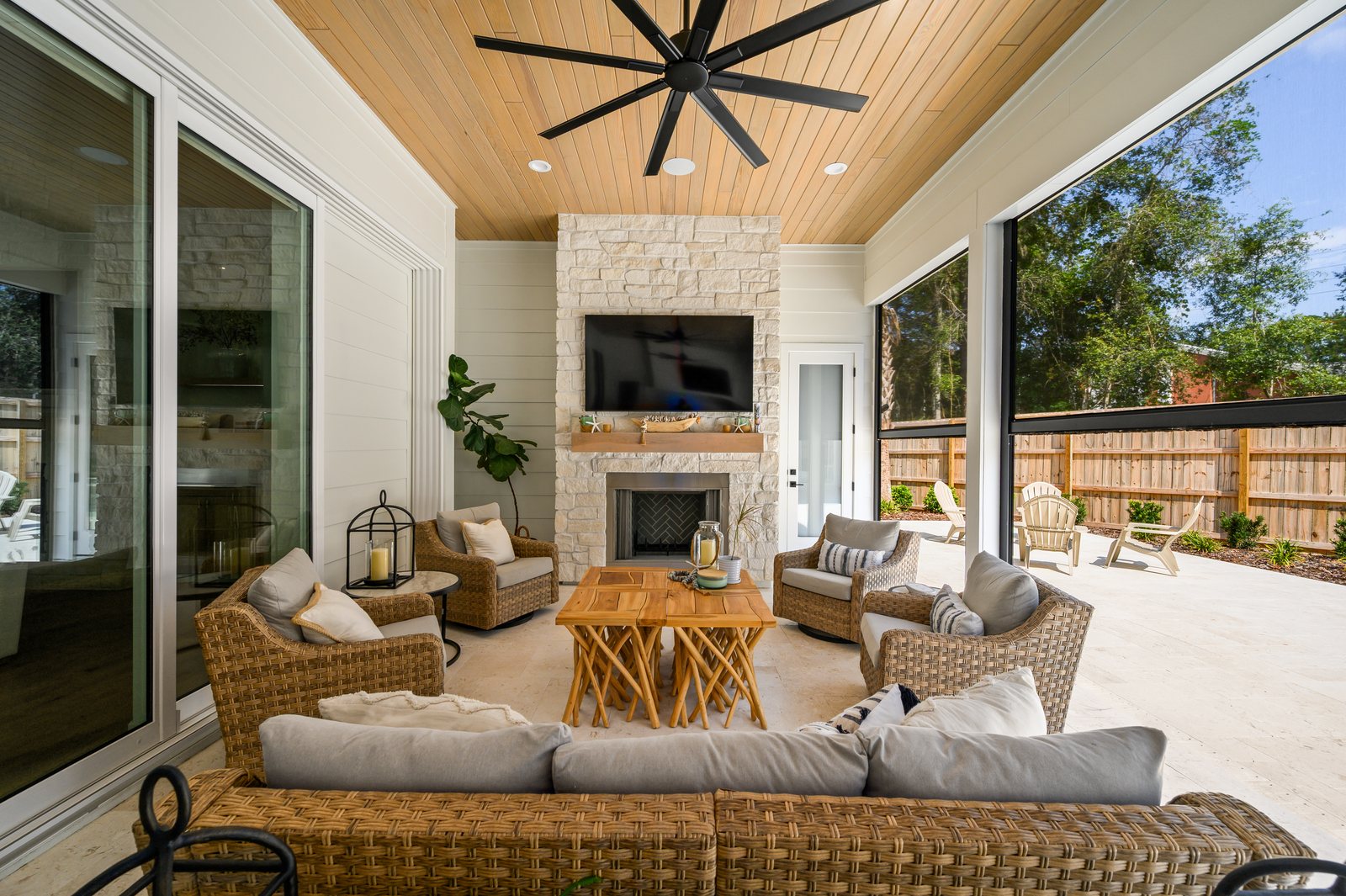 Covered lanai enclosed with motorized solar screens beside the pool